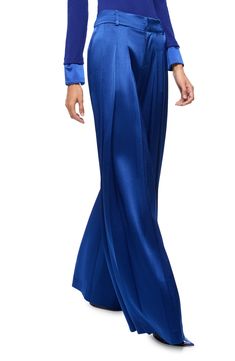 Pleated details add to the fabulous flow of wide-legged pants cut from lustrous satin and colored in a royal hue. 38" leg opening Zip fly with hook-and-bar closure Side-seam pockets; back welt pockets Lined 75% triacetate, 25% polyester Dry clean Imported Satin Pants, Walker Shoes, Holiday Pajamas, Platform Slippers, Silk Pants, Nyc Fashion, Denim Leggings, Skin Care Women, Comfortable Dress