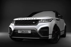 the front end of a white range rover