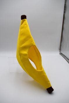 a yellow banana sitting on top of a white table