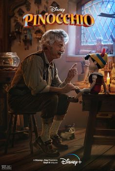 an older man sitting at a table next to a stuffed animal