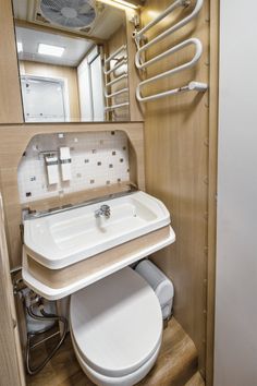 there is a small bathroom with a sink and toilet