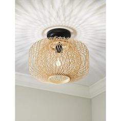 a ceiling light that is hanging from the ceiling in a room with white walls and ceilings