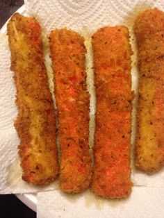 four pieces of fried food sitting on top of a paper towel