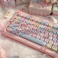 a pink and blue keyboard sitting on top of a table