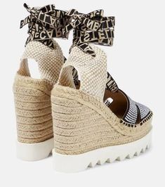 Stella McCartney’s embellished espadrille wedges bring a touch of elegance to the casual style. This pair sits on thick soles in woven jute and rubber, and features crystal-lined fronts and branded ankle straps..Trim: jute.Upper: fabric.Toe shape: square toe.Closure: ankle strap.Made in Spain.Comes with a box.Sole: rubber insole and sole.Comes with dust bag.True to size.Half sizes please take the next size up.European sizes.5cm-2' platform (size EU 38).13,5cm-5.5' wedge heel (size EU 38) Chic Embellished Wedge Sandals For Summer, Spring Embellished Wedge Sandals, Chic Straw Platform Espadrilles, Stella Mccartney Shoes, Ankle Straps, Espadrilles Wedges, Personal Shopping, Wedge Heels, Shoe Collection