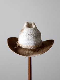 "This is a vintage white straw cowboy hat. The classic woven hat shows fantastic wear with a darkening to the tone of the brim. Rockmount Kushion-Komfort interior hat band. CONDITION In good condition with wear consistent with age and use. General wear and aged tone. Tiny spot of end fray on the side brim. MARKED SIZE: 7 MEASUREMENTS Interior Circumference: 21.75\" .. 55.2 cm Height: 5.25\" .. 13.3 cm Brim: 3.25\" .. 8.3 cm 72037" Hippie Boots, Woven Hat, Straw Cowboy Hat, Hat Band, Cowboy Hat, Hat Shop, Vintage 70s, White Vintage, Cowboy Boots