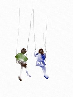 two people swinging on strings in the air