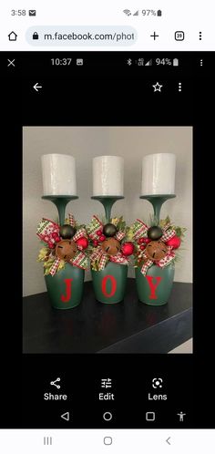 three green vases with christmas decorations on them and the words joy written in red