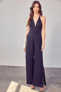 The Deep V-Neck Wide Leg Jumpsuit is a glamorous and versatile fashion piece that's perfect for making a statement. With its plunging neckline and wide-leg design, it exudes elegance and elongates the silhouette, making it a striking choice for formal events or evenings out. This jumpsuit combines sophistication with a touch of allure, ensuring you stand out in any crowd.Size + Fit- Model is wearing size S- Measurements taken from size S- 5'9" / 175CM- 32-24-34Measurement from a Small:Bust: 16"Length: 57.5" Style: Casual Print / Pattern: Solid Silhouette: Jumpsuit Fit: Regular Embellishment: Side Slit Neck Line: V-Neck Sleeve: Sleeveless Length: Long Closure: Back Zipper Lining: Yes Made In: CHINAFabric Contents: Self: 92% Polyester 8% Spandex, Lining: 100% Polyester Non-stretch fabric Non Jumpsuit Fitted, Halter Neck Jumpsuit, Stylish Jumpsuit, Jumpsuit Elegant, Leg Design, Sheer Fabric, Senior Year, Wide Leg Jumpsuit, Black Jumpsuit