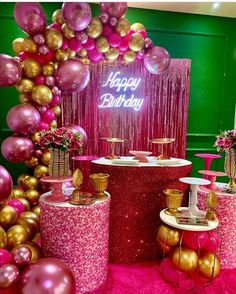 a pink and gold birthday party with balloons