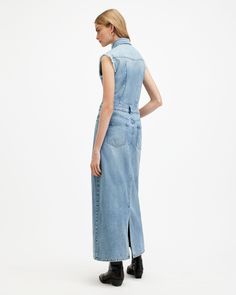 A new take on the denim dress. A classic shirt silhouette without the sleeves. It's giving 90s vibes with a bit of attitude. The maxi length is a great shape accentuated by the low waistband and slim fit. It's crafted from authentic denim made from organic cotton with patch chest pockets and distressed detailing at the sleeves. The Blair is a little different.    This dress is designed to a slim fit Sleeveless Button closure Maxi length Low waistband Five pocket construction Sleeveless Relaxed Fit Denim Dress, Maxi Denim Dress, Denim Dress Outfit, Shirt Silhouette, Denim Maxi Dress, Leather Western Boots, 90s Vibes, Denim Maxi, Western Leather