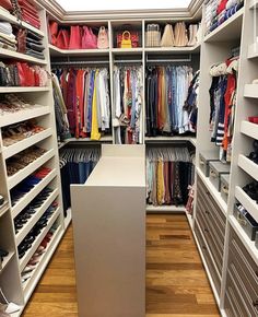 the closet is full of clothes and shoes