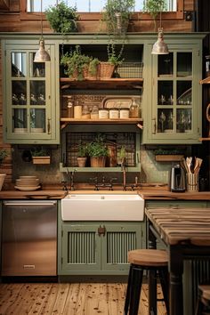 a kitchen with green cabinets and wooden floors