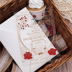 a wedding card in a wicker basket next to a cup and paper doily