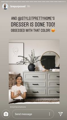 a woman sitting on top of a bed next to a dresser