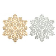 two gold and silver snowflakes sitting side by side