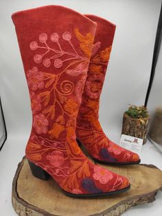 These are genuine leather handembroidered custom made  knee high boots. Made with genuine leather, suzani embroidered velvet, special sole, ykk zipper. There is every size is available, 6 us to 10.5 us, 36 eu to 42 eu. These boots are light and ultra confortable. Water proof, wearable under the rain, snow, sunshine. İf you need wider calf please send us your calf circle measurments. These are hand made boots.  İf you would like to get lower heel or round toe boots please send us message. Bohemian Knee-high Boots For Festivals, Bohemian Embroidered Boots For Fall, Embroidered Leather Knee-high Boots, Embroidered Snip Toe Boots For Festival, Red Bohemian Boots For Fall, Embroidered Red Boots With Round Toe, Red Embroidered Boots With Round Toe, Bohemian Leather Boots With Floral Embroidery, Bohemian Red Leather Boots