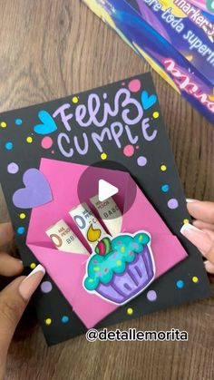 someone is holding up a card with a cupcake on it that says fessi cumpt