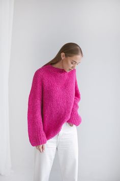 "Crafted from a soft blend of alpaca wool and silk in a vivid shade of pink, this sweater is designed for an oversized fit and has chunky ribbed trims, laid-back drooped shoulders. Wear it with classic trousers, jeans or wide skirts. Composition: alpaca wool, silk. Cerise color. Available sizes Petit size/XS/S/M/L/XL The model wearing size M and she is 172 cm/5'8\" tall. We offer the possibility to make a garment by your own measurements if you send us a message. CARE INSTRUCTIONS For best resul Rose Pink Sweater Outfit, Pink Knitwear Outfit, Pink Wool Knitted Sweater, Pink Knitted Wool Sweater, Hot Pink Sweater Outfit, Cerise Color, Pink Sweater Outfit, Magenta Sweater, Pink Oversized Sweater