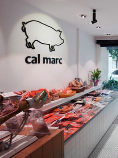 a counter with some food on it and a sign that says cal marc