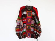 Bohemian Knit Poncho For Spring, Bohemian Knit Poncho, Bohemian Crochet Long Sleeve Top One Size, Oversized Bohemian Sweater For Spring, Winter Bohemian Crochet Top With Long Sleeves, Handmade Bohemian Crochet Long Sleeve Top, One Size Bohemian Sweater, Handmade Bohemian Long Sleeve Crochet Top, Bohemian Chunky Knit Sweater For Fall