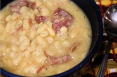 a bowl filled with macaroni and cheese on top of a checkered table cloth