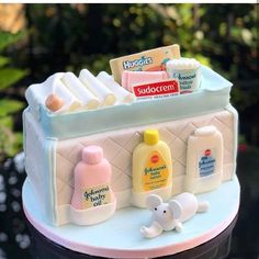 a cake made to look like a baby's changing table with items on it