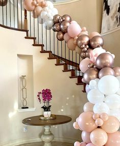 the staircase is decorated with balloons and flowers