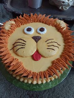 a cake decorated to look like a lion's face