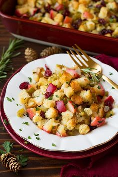 a white plate topped with stuffing next to a casserole dish