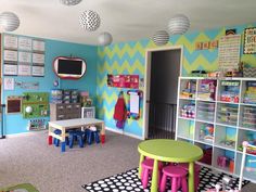 this is a child's playroom with toys and decor