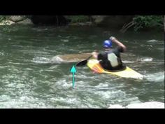 a man riding on top of a yellow surfboard in the middle of a river