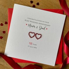 an anniversary card with two hearts on it