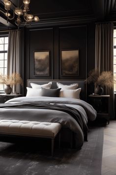 a large bed sitting next to two windows in a room with black walls and wooden flooring