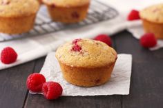 some raspberry muffins are sitting on a table