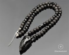 "Natural Big Obsidian Pendant Onyx Lava Beads Necklace Genuine Crystal Beaded Necklace Luck Unisex Father's Day Gift Necklace -ALL THE PRODUCTS AT ELISAJEWELRYART ARE HANDMADE AND MADE WITH NATURAL BEADS. -WHAT DOES THE OBSIDIAN STAND FOR Obsidian is all about protection and grounding. This dark and dreamy gemstone is a truth seeker and is all about getting tethered, staying safe and protected from negative energies, and helping you to face the truth so you can live authentically. -WHAT DOES THE Obsidian Beaded Jewelry As Gift, Obsidian Beaded Jewelry Gift, Obsidian Beaded Jewelry For Gift, Beaded Obsidian Jewelry Gift, Obsidian Necklace With 8mm Beads As Gift, Black Polished Pendant Beaded Necklaces, Black Beaded Necklaces With Polished Pendant, Black Beaded Necklace With Polished Pendant, Black Polished Beads Necklace With Pendant