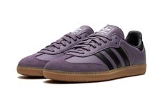 The Women’s adidas Samba OG “Shadow Violet” is a women’s colorway of the retro indoor soccer sneaker with a purple-based appearance.  The shoe is complete with a Shadow Violet leather upper and tonal suede overlays.  The Three Stripes branding on either side of the shoe is rendered in black leather.  A gold “Samba” logo appears on the lateral side of the mid-panel.  Classic adidas insignia is found on the tongue.  A gum rubber sole finishes off the appealing colorway.  Release date: August 15, 2 Purple Shoes Women, Purple Adidas Shoes, Purple Sambas, Dark Purple Shoes, Adidas Shoes Samba, Stripes Branding, Purple Adidas, Samba Outfit, Classic Adidas