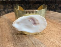 Handmade! Real oyster shell on a gold cuff bracelet.  Also comes in bronze and silver.  Bracelet is bendable some,  so it will adjust to fit. Shell is from Litchfield Beach South Carolina. Free shipping! Gold Cuff Bracelet, Beach South Carolina, Gold Bracelet Cuff, Gold Cuffs, Gold Bangle Bracelet, Gold Bangle, Oyster Shell, Gold Bangles, Bangle Bracelet