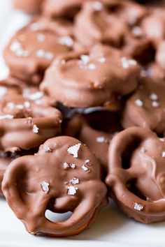 chocolate covered cookies with white sugar on top