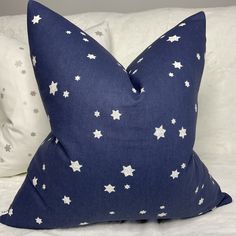 a blue pillow with white stars on it