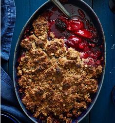 berry cobbler with ice cream and berries in it