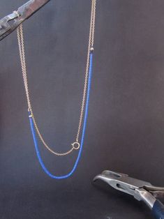 If you want to pay with PayPal, please contact me. Necklace details: * The necklace made from 14 karats solid yellow gold, and Blue Lapis stones. * Gold chain length: 15.7inch/ 40cm'. * Lapis chain length: 7.9inch/ 20cm. * the total length of the necklace: 23.6inch/ 60cm. Beautiful gold and Lapis chain necklace. sophisticated in its simplicity. The necklace can also be used as a bracelet. IF YOU WANT A CUSTOM necklace please contact me before purchase. When I write Handmade I really mean it. eac Elegant Blue Jewelry With Beaded Chain, Elegant Blue Beaded Chain Jewelry, Blue 14k Gold Necklace With Adjustable Chain, 14k Gold Necklace With Blue Adjustable Chain, Single Strand 14k Yellow Gold Jewelry, Dainty Blue Chain Jewelry, Sterling Silver Chain Jewelry In Blue, Sterling Silver Blue Chain Jewelry, Fine Jewelry With Blue Delicate Chain