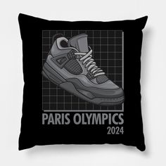 a black pillow with a grey sneaker on it that says paris olympics 2012 in front of a grid pattern