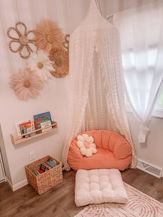 a room with a bed, chair and bookshelf on the floor in front of a window