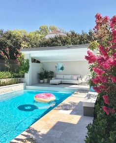 a pool with an inflatable floater sitting next to it