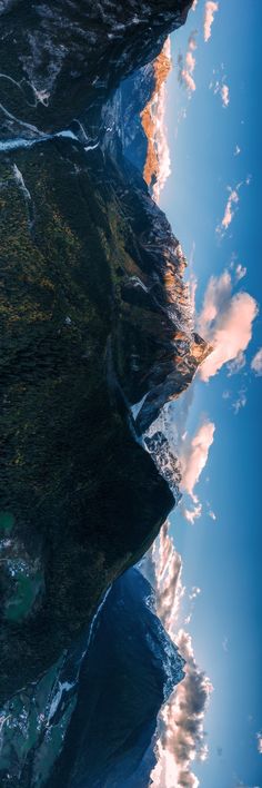 the sky and clouds are reflected in the water