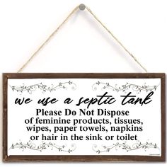 a sign hanging on the wall that says we use a toilet talk please don't dispuse off feminine products, tissues, wipes, paper towels, napkins or hair in the sink or toilet