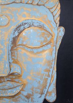 a painting of a buddha head on a black wall