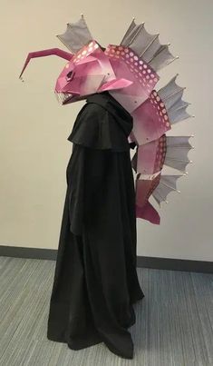 a person in a costume with a dragon head