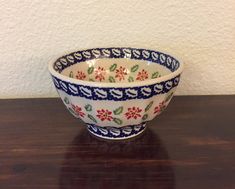 a bowl sitting on top of a wooden table